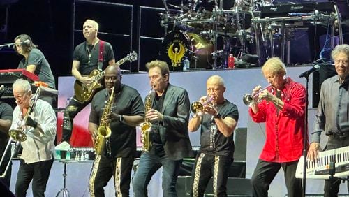 Earth, Wind & Fire joined forces with Chicago on stage for a six-song encore at Ameris Amphitheatre in Alpharetta Aug. 19, 2024. RODNEY HO/rho@ajc.com