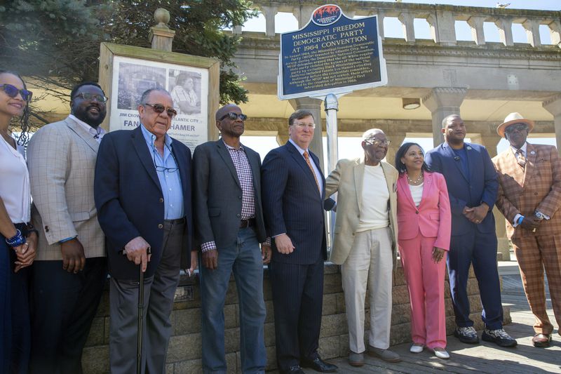 Elected officials and civil rights advocates unveil a Mississippi Freedom Trail marker on the boardwalk in Atlantic City, N.J., Tuesday, Aug. 20, 2024. From left: Tiyi Morris, daughter of civil rights advocate Euvestor Simpson; John Spann, Mississippi Humanities Council; Freedom Democrat Dave Dennis Sr.; Roy DeBerry of the Student Nonviolent Coordinating Committee; Mississippi Governor Tate Reeves; Ralph Hunter of the The African American Heritage Museum of Southern New Jersey; Tahesha Way, New Jersey Lieutenant Governor; Marty Small, Mayor of Atlantic City and Kaleem Shabazz, Atlantic City councilman. (AP Photo/Ted Shaffrey)