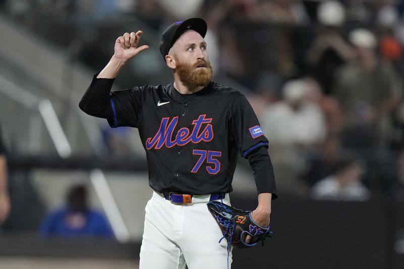 New York Mets pitcher Reed Garrett watches a grand slam by San Francisco Giants' Patrick Bailey during the eighth inning of a baseball game, Friday, May 24, 2024, in New York. (AP Photo/Frank Franklin II)