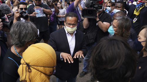 FILE - Minnesota Attorney General Keith Ellison, center, speaks with Rep. Ilhan Omar, D-Minn., and members of the Congressional Black Caucus as they visit the site of George Floyd's death in south Minneapolis on June 4, 2020. (Anthony Souffle/Star Tribune via AP, File)