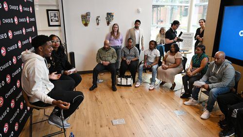 Atlanta Hawks guard Trent Forrest (left) speaks as Alexis Roe (second from left), Atlanta Hawks’ Vice President of DEI Impact and Strategic Initiatives, moderates during educational workshops to enhance their financial health and understanding of business finances at Summerhill Chase Community Center Branch, Tuesday, March 26, 2024, in Atlanta. The Atlanta Hawks and Chase are launching a new community program for aspiring entrepreneurs impacted by the justice system. (Hyosub Shin / Hyosub.Shin@ajc.com)