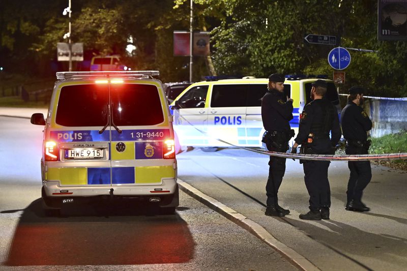 Police guard outside the Israeli embassy in Stockholm, Sweden, Tuesday, Oct. 1, 2024, after a suspected shooting near the embassy. (Anders Wiklund/TT News Agency via AP)