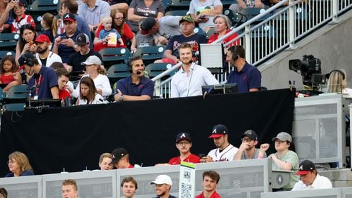 052722 Atlanta: Bally Sports Southeast broadcasters Chip Caray, center left, and Jeff Francoeur, center right, interview Atlanta Braves pitcher Mike Soroka, center, as they broadcast the Atlanta Braves vs Miami Marlins game from the right field stands in front of the Coors Light Chop House at Truist Park Friday, May 27, 2022, in Atlanta. The broadcast was moved from the press box and promoted as, “Baseball from the Bleachers.” (Jason Getz / Jason.Getz@ajc.com)