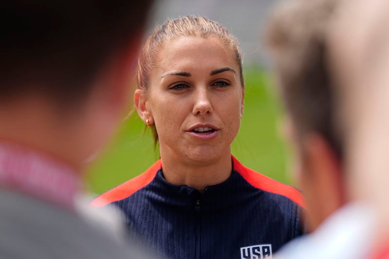 FILE - United States national women's soccer team player Alex Morgan talks to reporters before a practice to prepare for a friendly match against South Korea, Friday, May 31, 2024, in Commerce City, Colo. (AP Photo/David Zalubowski, File)