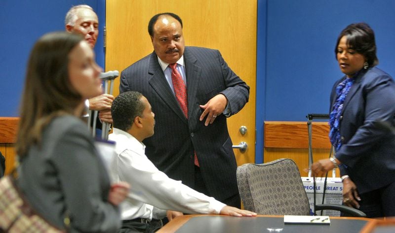 Dexter King (left-seated) greets Martin Luther King III (center) as sister, Bernice King looks on after arriving in court Monday morning. The children of Martin Luther King Jr. met in Fulton County court Monday October 12, 2009 for the next chapter in a family financial fight that friends say threatens to soil their fatherÃ­s legacy. Most of the morning was spent behind closed doors as Fulton County Superior Court Judge Ural Glanville handled other pending cases. The siblings briefly met before hand with cordial greetings before retiring to a back room before being dismissed for lunch just after noon. Fulton County Superior Court Judge Ural Glanville has tried to encourage an out-of-court settlement of what is, at its core, a feud over the company that controls KingÃ­s legacy and an estate worth millions of dollars. He has appointed an auditor to investigate the dispute. Barring a settlement, jury selection will begin in a suit filed against Dexter King by his two siblings. The Rev. Joseph E. Lowery, a King family intimate, said he remains hopeful the family can resolve the dispute without a protracted public court fight. Bernice, 46, and Martin Luther King III, 51, say they have sued their 48-year-old brother Dexter in part to protect that legacy.
