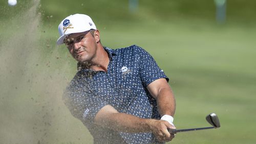 Captain Bryson DeChambeau, of Crushers GC, hits from a bunker on the 12th hole during the first round of LIV Golf Chicago at Bolingbrook Golf Club, Friday, Sept. 13, 2024, in Bolingbrook, Ill. (Matthew Harris/LIV Golf via AP)