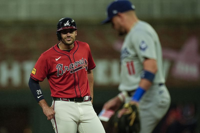 Atlanta Braves' Matt Olson (28) celebrates his RBI-double against the Los Angeles Dodgers inning of a baseball game, Friday, Sept. 13, 2024, in Atlanta. (AP Photo/Mike Stewart)