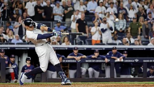 New York Yankees' Aaron Judge hits a grand slam during the seventh inning of a baseball game at bat Friday, Sept. 13, 2024, in New York. (AP Photo/Adam Hunger)