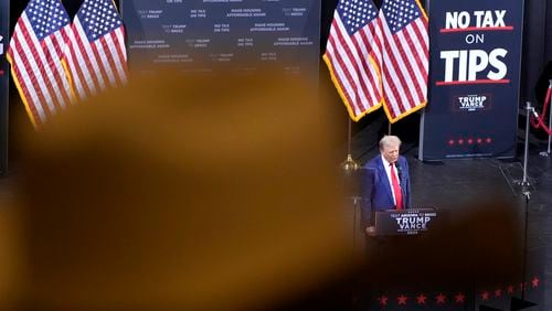 FILE - A supporter listens as Republican presidential nominee former President Donald Trump speaks during a campaign event, Sept.12, 2024, in Tucson, Ariz. (AP Photo/Alex Brandon, File)