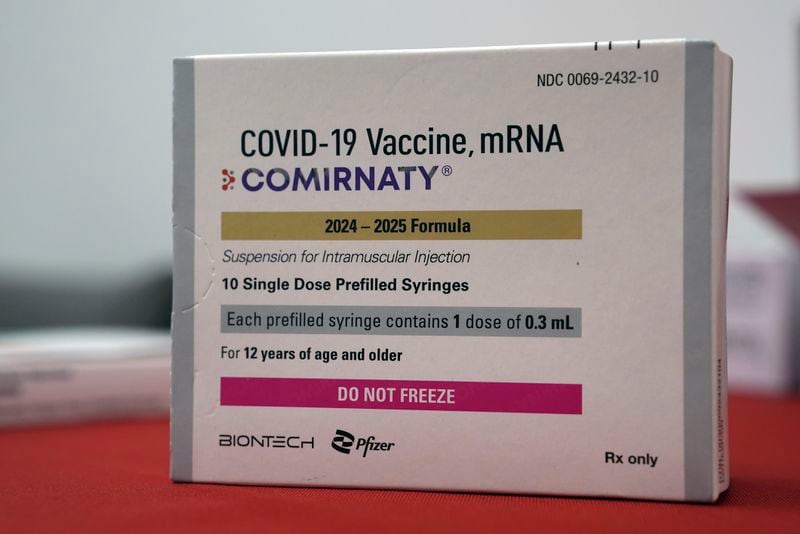 A box of COVID-19 vaccines is displayed at a pharmacy in New York, Tuesday, Sept. 24, 2024. (AP Photo/Mary Conlon)