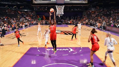 Tina Charles (31) of the Atlanta Dream rebounds the ball during the game against the Phoenix Mercury on Sept. 3, 2024 at Footprint Center in Phoenix, Arizona.