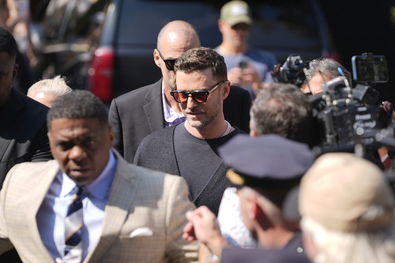 Justin Timberlake, center, walks into court for his arraignment, Friday, Sept. 13, 2024, in Sag Harbor, N.Y. (AP Photo/Pamela Smith)