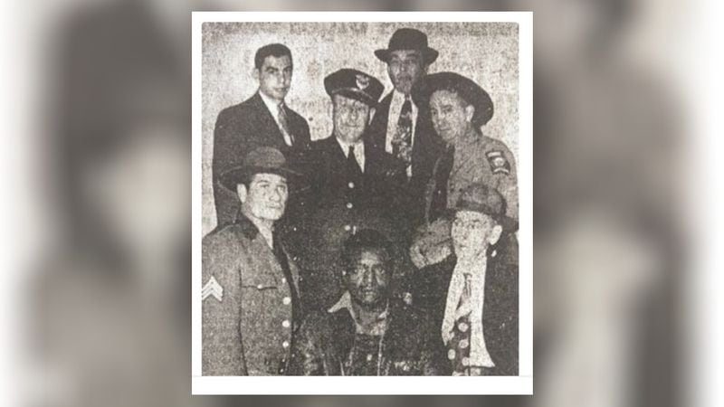 Carrollton sharecropper Clarence Henderson is photographed moments before his first trial on Jan. 30, 1950, while ringed by state and local law enforcement. The one-day trial was a spectacle and held under tight security with armed state troopers in the courtroom. Henderson would be convicted three times in separate trials which were all overturned. (File)