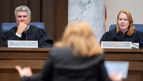 Georgia Supreme Court Chief Justice Michael Boggs and Justice Sarah Warren listen to oral arguments from attorney Elizabeth Young, representing the Secretary of State, at the Supreme Court in Atlanta on Tuesday, September 24, 2024. The court will decide whether minor presidential candidates Cornel West and Claudia De la Cruz should be on the November ballot. (Arvin Temkar / AJC)