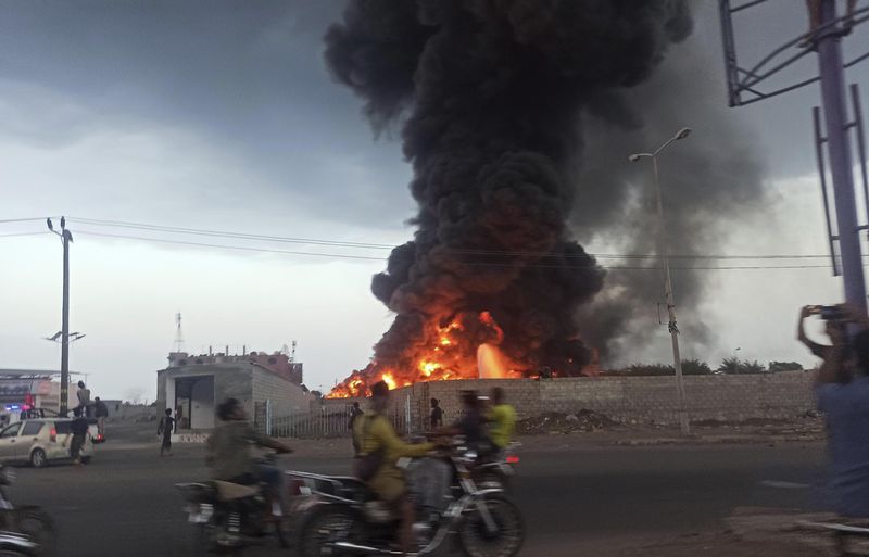 A large fire and plume of smoke is visible in the port city of Hodeida, Yemen, on Sunday, Sept. 29, 2024, after Israeli strikes on the Houthi-controlled city. (AP Photo)