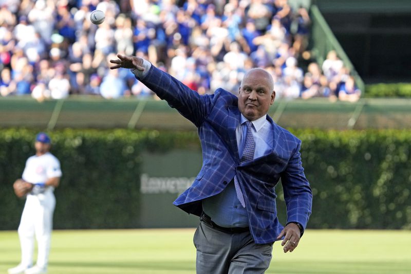 Ryne Sandberg throws out a ceremonial first pitch before a baseball game between the New York Mets and the Chicago Cubs in Chicago, Sunday, June 23, 2024. (AP Photo/Nam Y. Huh)