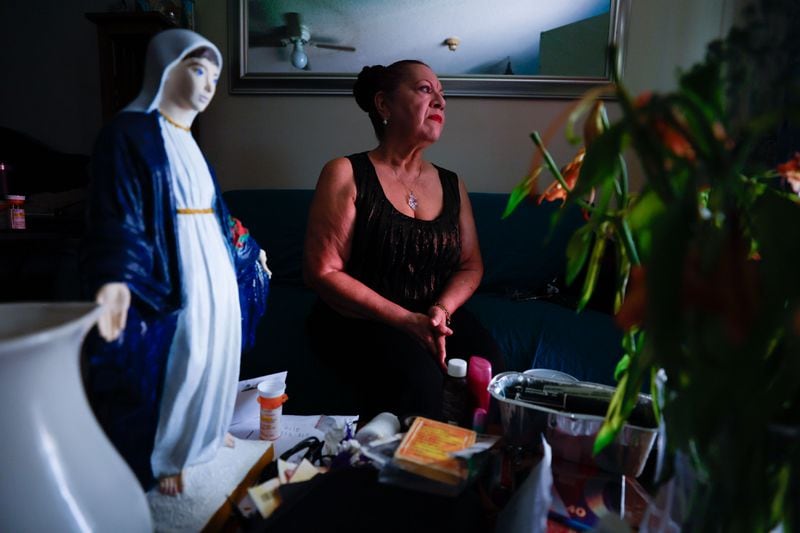 Fulton County resident Elizabeth Bustamante poses for a photograph in her apartment on Thursday, July 18. The Fulton County Housing Authority has been late on rent payments for two months, leading to concerns among tenants like Elizabeth Bustamante about the risk of losing their homes.
(Miguel Martinez / AJC)