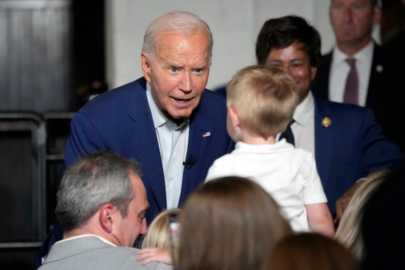 President Joe Biden greets supporters at Garage Grill & Fuel Bar during a campaign stop in Northville, Mich., Friday July 12, 2024. (AP Photo/Jacquelyn Martin)