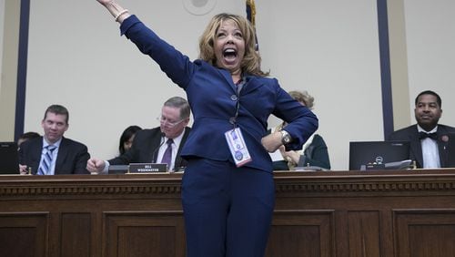 Rep.-elect Lucy McBath, D-Marietta, celebrates after drawing a low number in the lottery for congressional offices on Capitol Hill on Nov. 30, 2018. As part of the new member orientation process, incoming House freshmen take part in drawing random numbers that provide the order for selecting available congressional office space. (Photo by Win McNamee/Getty Images)