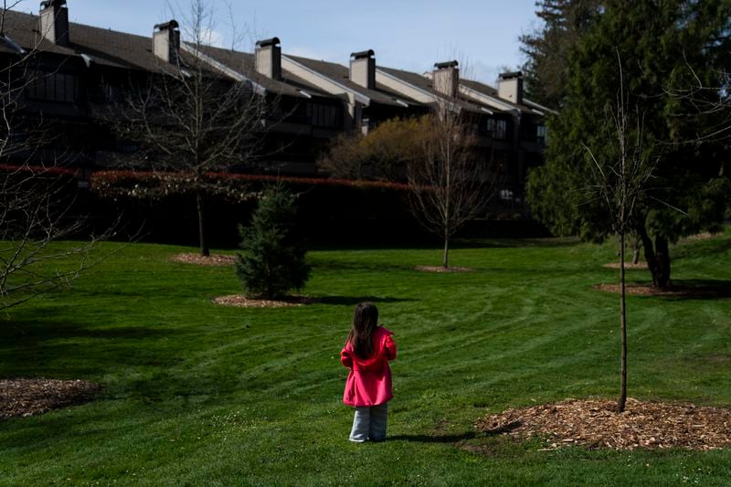 FILE - A homeless child plays in the park after receiving free food with her mother and sister, in Riverside Park, March 21, 2024, in Grants Pass, Ore. On Friday, June 28, the Supreme Court ruled that cities can enforce bans on homeless people sleeping outdoors in West Coast areas where shelter space is lacking. (AP Photo/Jenny Kane, File)