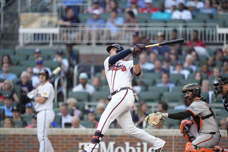 Atlanta Braves' Austin Riley (27) hits a solo home run in the second inning of a baseball game against the San Francisco Giants, Tuesday, July 2, 2024, in Atlanta. (AP Photo/Brynn Anderson)
