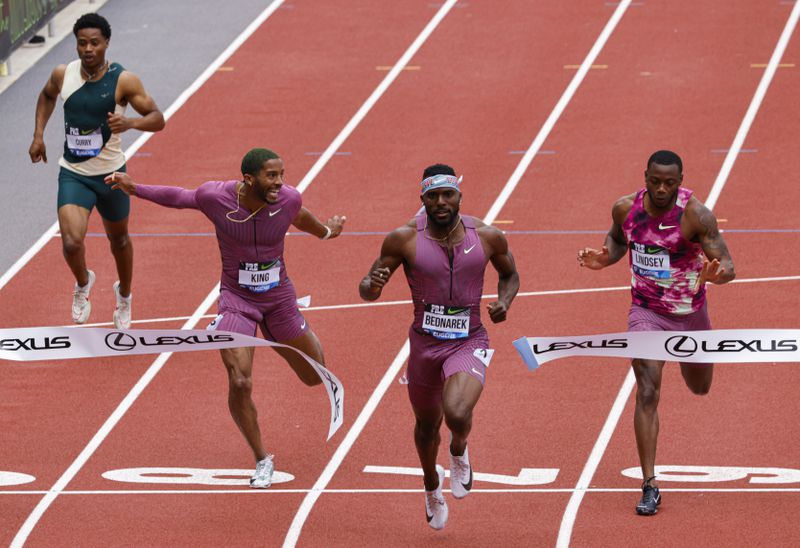 Kenneth Bednarek wins the men's 200 meters at the Prefontaine Classic track and field meet Saturday, May 25, 2024, in Eugene, Ore. Courtney Lindsey, right, was second, and Kyree King, second from left, was third. (AP Photo/Thomas Boyd)