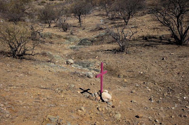 Crosses left by border activists mark the locations where the remains of migrants who died trying to cross into the United States through the harsh conditions of the Sonoran Desert were discovered, in the Altar Valley, Arizona. (ANDREW LICHTENSTEIN/CORBIS/GETTY IMAGES)