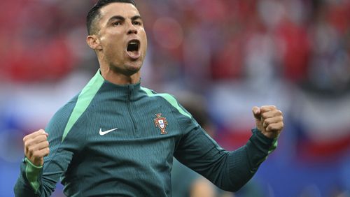 Portugal's Cristiano Ronaldo shouts during the warm up prior for a Group F match between Portugal and Czech Republic at the Euro 2024 soccer tournament in Leipzig, Germany, Tuesday, June 18, 2024. (Robert Michael/dpa via AP)