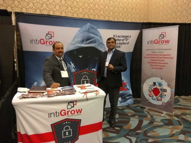 US Business Development team members from intiGrow teaming up at one of the many tradeshow events where company officials discuss their cybersecurity experience.