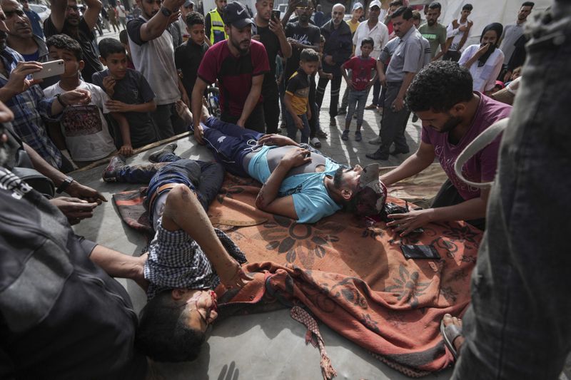 Palestinians killed in the Israeli bombardment of the Gaza Strip are brought to the Al Aqsa hospital in Deir al Balah, central Gaza Strip, on Monday, May 27, 2024. (AP Photo/Abdel Kareem Hana)