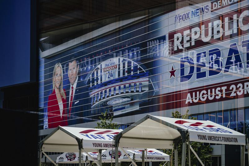 An advertisement on the side of the Fiserv Forum, where the first Republican presidential debate hosted by Fox News will be held, in Milwaukee, Wis, Aug. 22, 2023. (Jamie Kelter Davis/The New York Times)