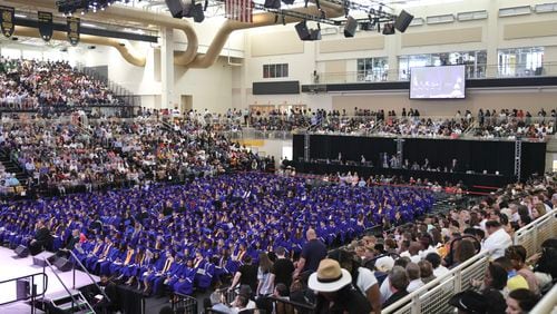 A slightly higher proportion of students graduated on time last spring, according to the Georgia Department of Education. Families and students gather at Kennesaw State University Convocation Center for Campbell High School graduation on Wednesday, May 24, 2023. (Natrice Miller/natrice.miller@ajc.com)
