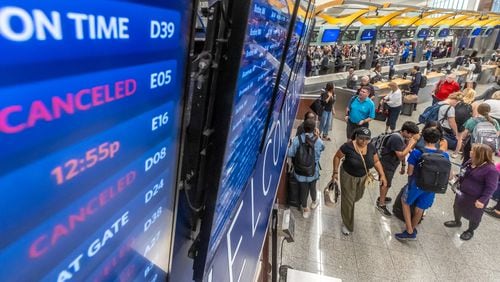 Cancelled flights on Delta Air Lines’ boards greeted fliers as a massive outage affected Microsoft users around the globe, disrupting airlines, railways, banks, stock exchanges and other businesses. U.S. airlines including Delta, United and American grounded flights, and airlines and airports across the globe were affected. (John Spink/AJC)