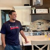 Georgia great and College Football Hall of Famer David Pollack speaks with a visitor to his Oconee County home in September 2024. (AJC photo by Ken Sugiura)