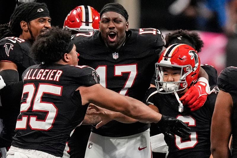 Atlanta Falcons players celebrate place kicker Younghoe Koo's game-winning 58-yard-field goal against the New Orleans Saints during the second half of an NFL football game, Sunday, Sept. 29, 2024, in Atlanta. (AP Photo/John Bazemore)