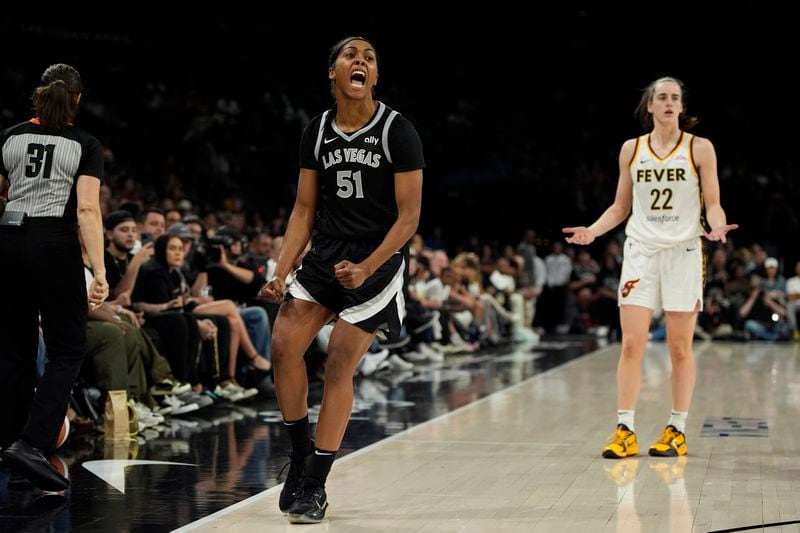 Las Vegas Aces guard Sydney Colson (51) celebrates after a play against the Indiana Fever during the second half of a WNBA basketball game Saturday, May 25, 2024, in Las Vegas. (AP Photo/John Locher)