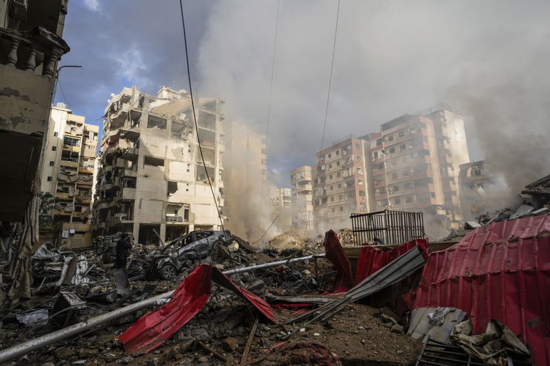 Smoke rises from the site of an Israeli airstrike in Beirut's southern suburb, Lebanon, Tuesday, Oct. 1, 2024. (AP Photo/Hassan Ammar)