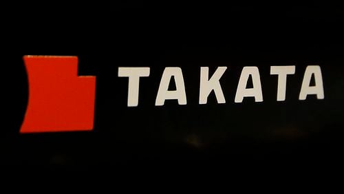 FILE - The logo of Takata Corp. is displayed at an auto supply shop in Tokyo, July 6, 2016. (AP Photo/Shizuo Kambayashi, File)