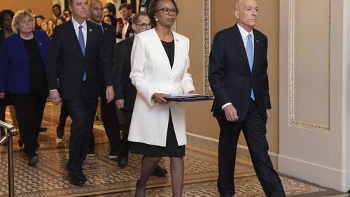 House Sergeant at Arms Paul Irving and Clerk of the House Cheryl Johnson carry the articles of impeachment against President Donald Trump to Secretary of the Senate Julie Adams on Capitol Hill in Washington, Wednesday, Jan. 15, 2020. Following are impeachment managers, House Judiciary Committee Chairman, Rep. Jerrold Nadler, D-N.Y., House Intelligence Committee Chairman Adam Schiff, D-Calif., Rep. Hakeem Jeffries, D-N.Y., Rep. Sylvia Garcia, D-Texas, Rep. Val Demings, D-Fla., Rep. Zoe Lofgren, D-Calif., and Rep. Jason Crow, D-Colo. (AP Photo/Manuel Balce Ceneta)