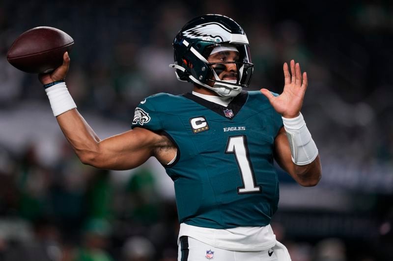 Philadelphia Eagles quarterback Jalen Hurts warms up before an NFL football game against the Atlanta Falcons on Monday, Sept. 16, 2024, in Philadelphia. (AP Photo/Matt Slocum)