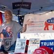 Charlotte Horvath, treasurer for the Banks County Republican Party, works a booth at the Labor Day Festival in Homer with political hats, signs and flags available for donations.  Banks County is a Republican stronghold, where Donald Trump won nearly 89% of the vote in 2020. Turnout is the big concern for Republican officials there. “We’re going to win this county," said Brian Parker, the county's Republican chair, "but we need as many votes here as we can get to take away from all the votes in Fulton County.” (Ben Gray / Ben@BenGray.com)