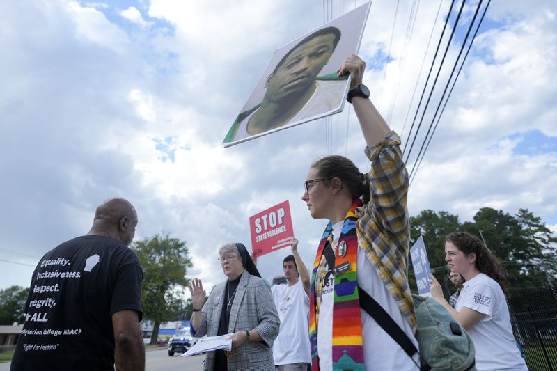 Rev. Hillary Taylor protests the planned execution of Freddie Eugene Owens, 46, on Friday, Sept. 20, 2024, in Columbia, S.C. Owens is set to be the first person to be executed in South Carolina in 13 years. (AP Photo/Chris Carlson)