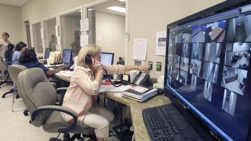 110407 - Flowery Branch - Michele Morris, program assistant, watches over patients from the nurses station.  Most of the areas are also monitored via closed circuit TV.   Avita Community Partners, a non-profit organizaton that serves persons with behavioral health, developmental disabilities and addictive diseases in North Georgia, operates this new 16 bed Crisis Stabilazation Unit opened by the state Department of Behavioral Health and Developmental Disabilities in North Georgia's Flowery Branch community.  Bob Andres bandres@ajc.com