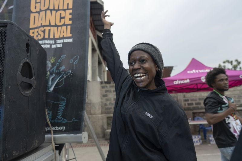 Virginie Magumba, 22, a professional dancer from Goma, cheers during the annual Goma Dance Festival, in Goma, Saturday, June 15, 2024. The annual festival, which sees dancers from all over the world flocking to Goma, has been held in the city for the past seven years despite the ongoing attacks by rebel groups in the region. (AP Photo/Moses Sawasawa)