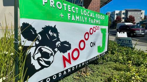 A sign outside a business urges voters to reject Measure J, which would phase out large-scale animal farms in Sonoma County, Thursday, Sept. 19, 2024, in Petaluma, Calif. (AP Photo/Haven Daley)