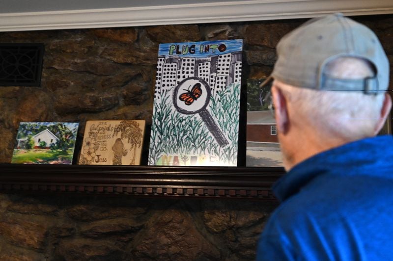 A painting by Joe Eifrid's granddaughter Jess Willadsen, who died in a house fire, is displayed as a reminder of the Rockdale Art Farm's purpose. (Hyosub Shin / AJC)