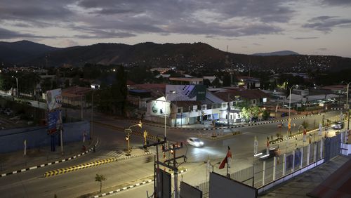 A street light is seen during a sunrise in Dili, East Timor Sunday, Sept. 8, 2024. (AP Photo/Firdia Lisnawati)