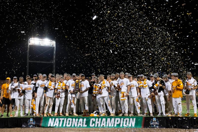 Tennessee holds the championship trophy after their victory over Texas A&M in Game 3 of the NCAA College World Series baseball finals in Omaha, Neb., Monday, June 24, 2024. (AP Photo/Rebecca S. Gratz)