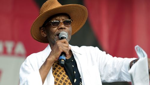 Ernest Gregory  emceeing the 2022 Atlanta Jazz Festival. Gregory became a key face of the festival for decades and also became a photographer of musicians performing in Atlanta and other places late in life. Akili-Casundria Ramsess for The Atlanta Journal-Constitution)�