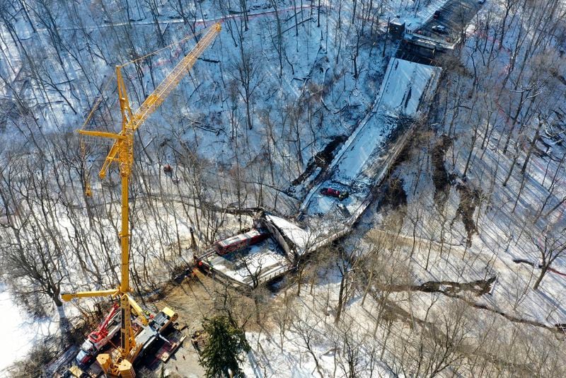 FILE - A crane is in place as part of clean up efforts at the Fern Hollow Bridge in Pittsburgh that collapsed, Jan. 28, 2022. I (AP Photo/Gene J. Puskar, file)